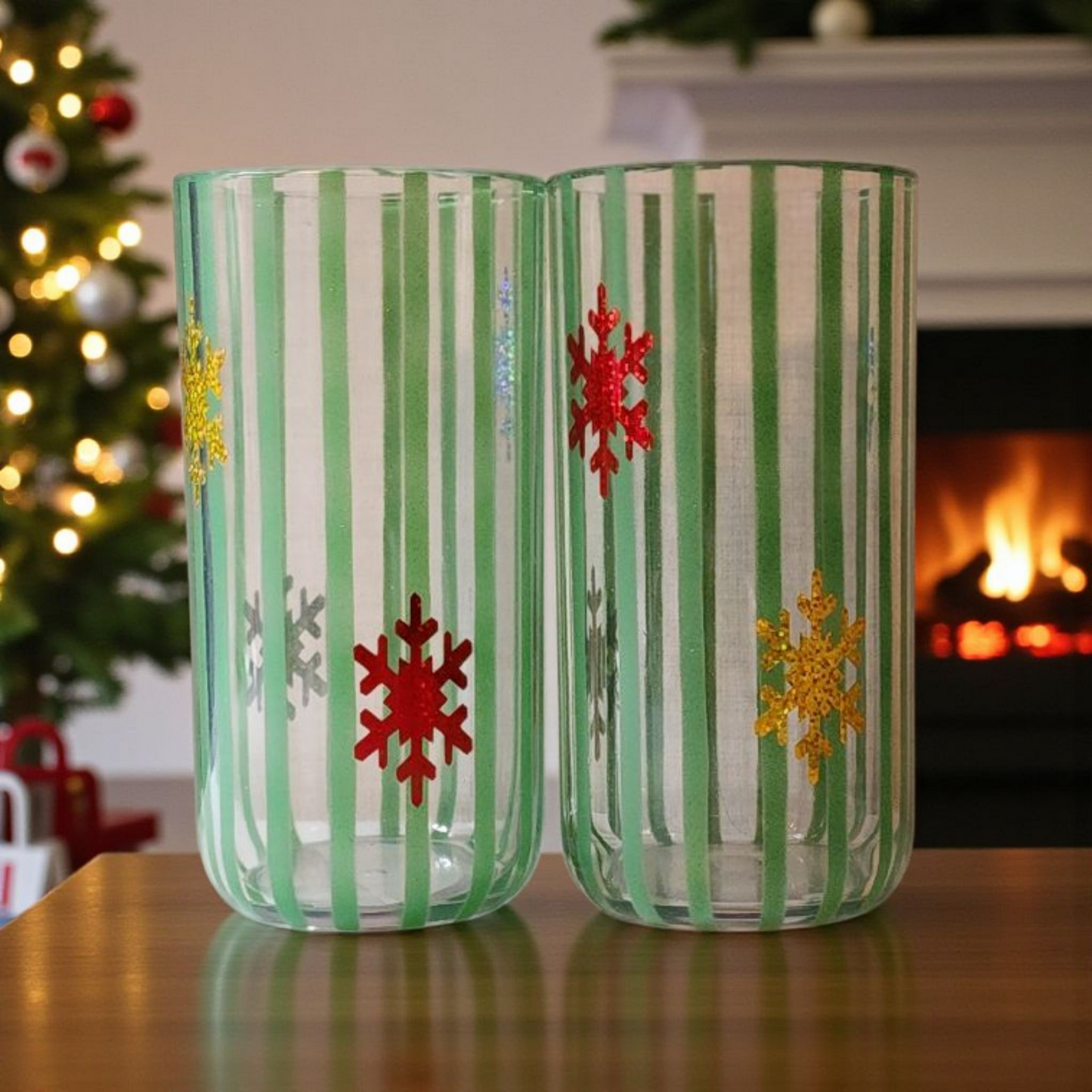 Multi-Colored Snowflakes on Green Striped Cup